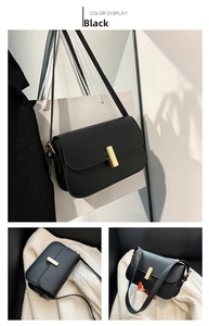 Detailed view of black matte leather crossbody bag with iconic gold rectangular buckle