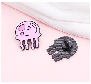 Detailed front and back view of a pink jellyfish enamel pin with a black rubber clutch