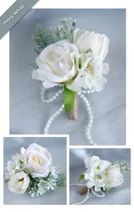 Detail of ivory artificial rose boutonniere with twine handle and pearl chain decor