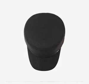 Top down view of black flat top cadet cap in durable textured cotton twill fabric
