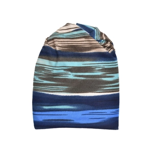 Detail of multi-colored striped knit beanie showing blue and brown abstract textures