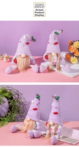Macro shot of purple plush Christmas gnomes set with fluffy hats and festive bell charms