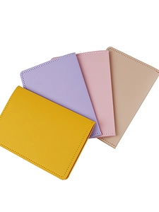 Faux leather travel passport holder wallets in yellow, purple, pink and beige tones