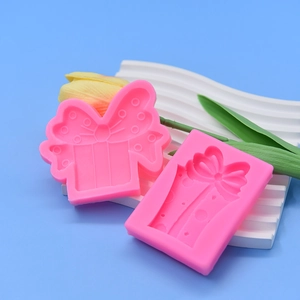 Pink silicone gift box and bow mold set for baking chocolate and fondant decoration