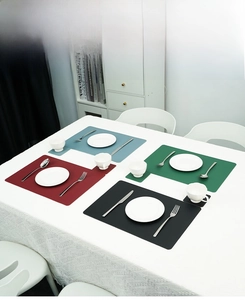 Detail of Nordic faux leather placemats with integrated coasters in four solid colors