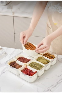 Detail of 8-compartment clear organizer box for kitchen spices and fresh condiments