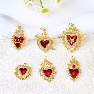 Gold-plated heart pendants with red crystals and zircon settings in various vintage designs