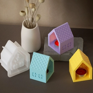 Macro detail of house-shaped silicone molds and colorful resin tea light holders