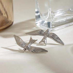 Minimalist silver stainless steel swallow bird earrings with a vintage 3D flying design
