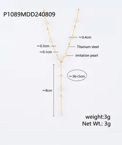 Detail view of 18k gold plated titanium steel Y-necklace with imitation pearls and sizing