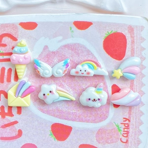 Macro shot of colorful resin charms including rainbow clouds and mini ice cream stars