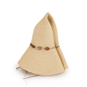 Detail of khaki wide brim straw hat showing flexible weave texture and beaded cord trim