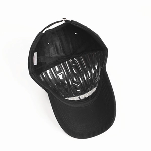 Detail of 100% cotton baseball cap interior with adjustable buckle and wash label