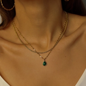 Double-layer stainless steel necklace with green teardrop stone pendant in gold finish