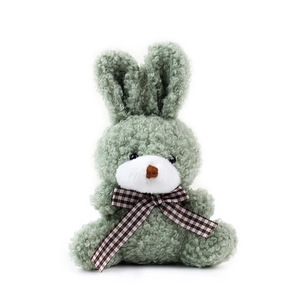 Cute green plush bunny sitting with brown plaid ribbon bow, soft stuffed rabbit toy