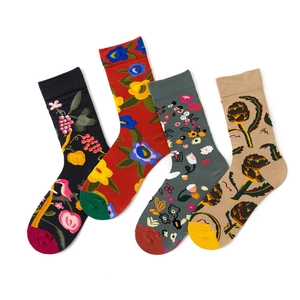 Flat lay of four cotton socks with diverse floral patterns in black red grey and beige