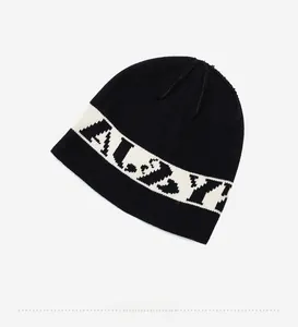 Detail view of black knit beanie with white ALYX jacquard stripe and fine ribbed texture