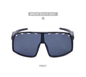 Front view of bright black cycling glasses with large gray lenses and vented frames
