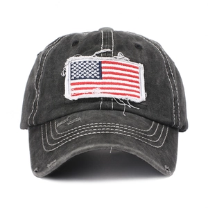 Distressed cotton baseball cap with American flag embroidery and vintage ponytail design