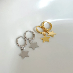 Close-up of S925 sterling silver star hoop earrings in silver and gold finishes