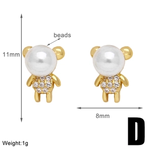 Detailed view of gold bear earrings with beads and rhinestones measuring 11mm by 8mm