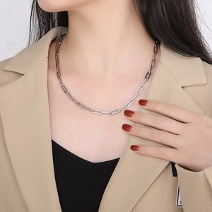 Minimalist silver stainless steel paperclip chain necklace with lobster clasp on a model