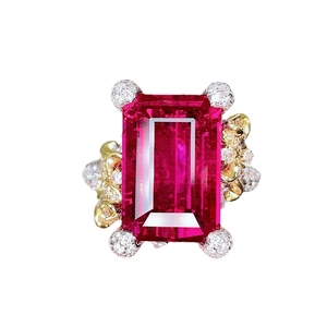 Luxurious camellia open ring featuring a large rectangular fuchsia gem and white diamonds
