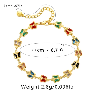 Detailed view of gold butterfly bracelet with dimensions 17cm plus 5cm extender