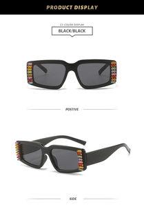 Detail view of black square sunglasses featuring vertical colorful rhinestone inlay on frame