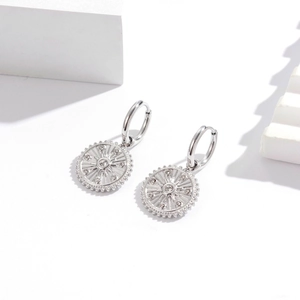 Silver stainless steel hoop earrings with sunburst circular pendant and zircon detail