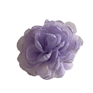 Elegant purple silk flower hair claw clip with layered petals for beach vacations