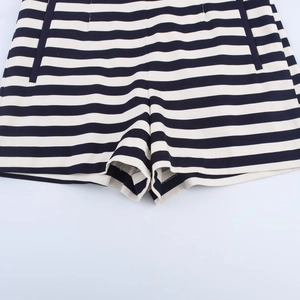 Close-up of high-waisted casual shorts featuring classic black and white horizontal stripes