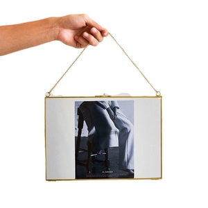 Golden brass hanging glass photo frame with chain and minimalist Nordic design