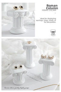 Detailed view of white matte resin Roman column stands for jewelry photography props