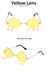 Détail de lunettes de soleil nuage jaunes sans monture avec gouttes d'eau et branches dorées