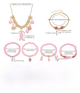 Detail view of pink ribbon awareness jewelry set including necklace and beaded bracelets