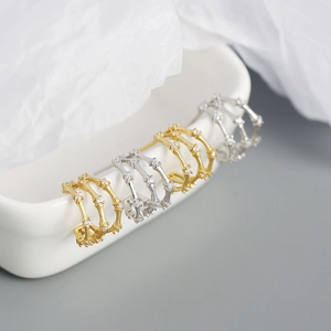 Three-layer bamboo-style C-shaped hoop earrings with micro-diamonds in gold and silver