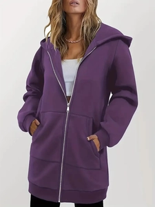 Close-up of purple longline hoodie featuring metal zipper and large front pockets