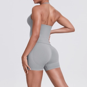 Side-back view of grey high-waist yoga set with halter neck top and lifting shorts