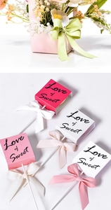 Lollipop-shaped floral gift cards with pink satin ribbons and Love of Sweet script