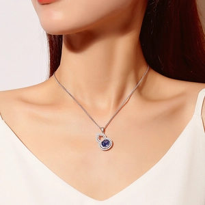 S925 silver necklace featuring a gourd pendant with oval purple stone on model