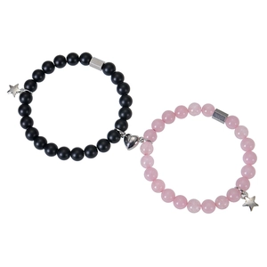 Close-up of heart magnet clasp connecting black and pink beads zebra stone bracelets