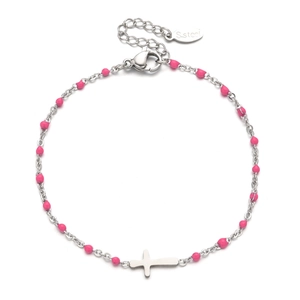 Macro detail of stainless steel bracelet with pink beads and a silver cross charm