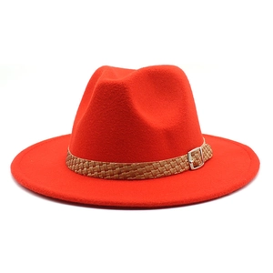 Vibrant red wool fedora hat with wide brim and brown braided band in a classic style