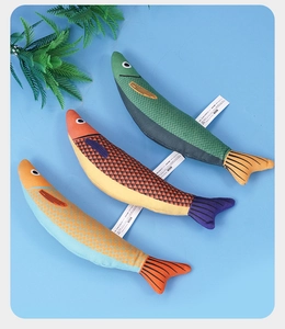 Detailed view of three colorful fabric fish toys for cats in orange, red and green tones