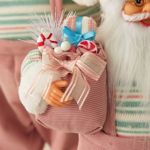 Statuetta di Babbo Natale rosa con sacco regalo decorativo, bastoncini di zucchero e pacchi