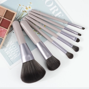 Detail of 8pcs soft makeup brushes with lavender handles and gray gradient bristles
