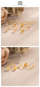 Macro de piercings de nez en titane doré avec cœurs et fleurs incrustés de zircons