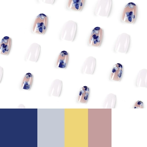 Short press-on nails featuring blue gradient flowers and gold glitter accents