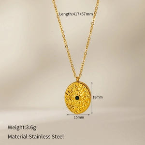 Detailed close-up of hammered gold clover necklace with natural stone on stainless steel